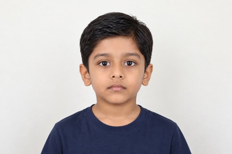 Facing the camera, mouth closed